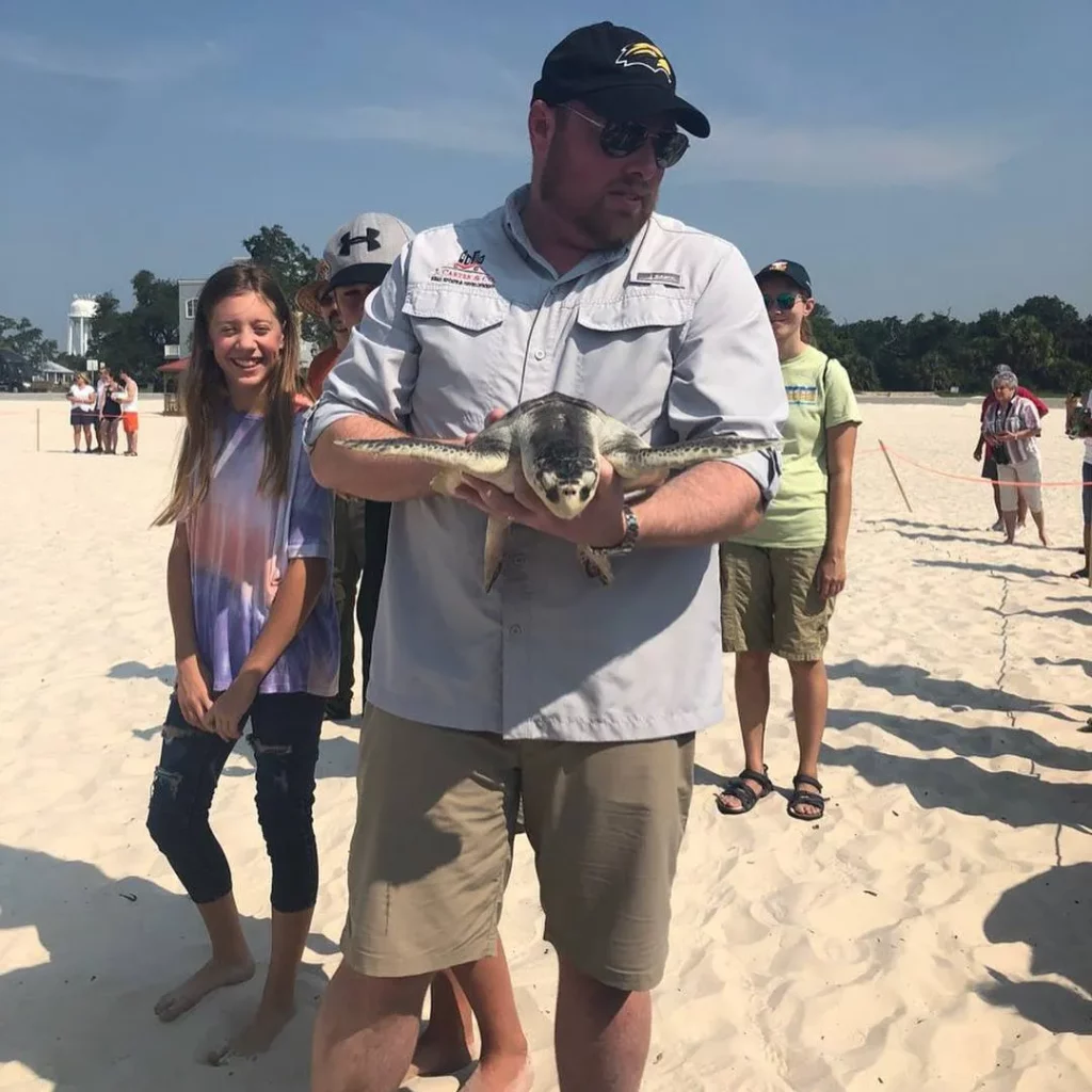 Joel Carter with a sea turtle